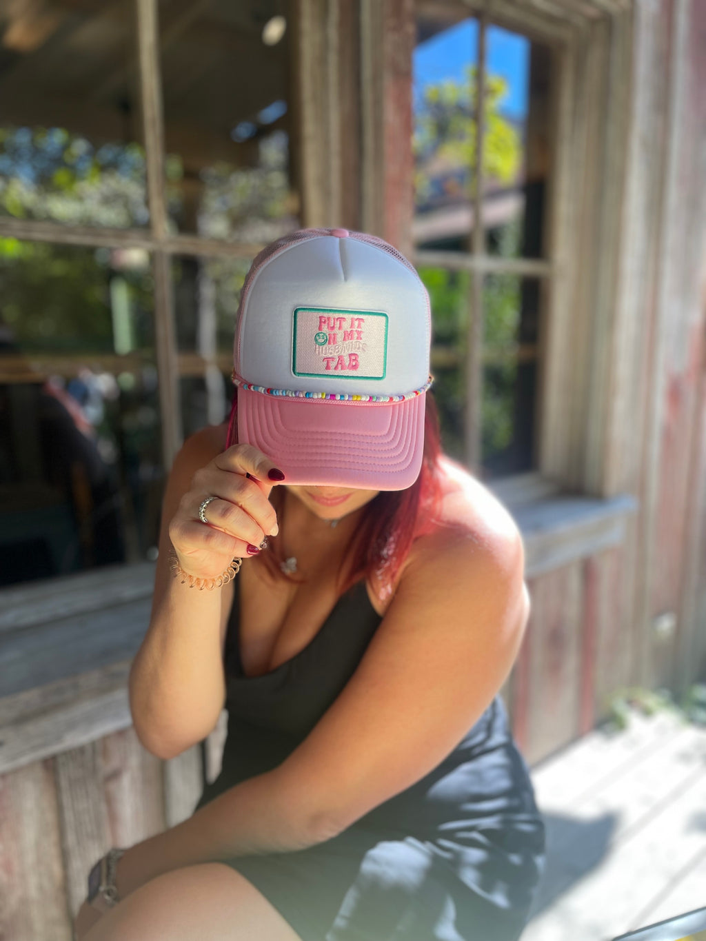 Put it on my Husbands Tab Trucker Hat