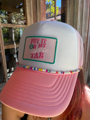 Put it on my Husbands Tab Trucker Hat